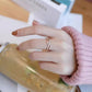 18K GOLD DOUBLE-LOOP RING